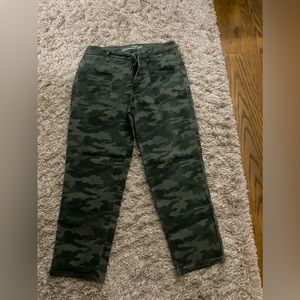 Excellent straight leg camouflage jeans. Cargo pockets in back with gold snap.